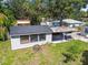 A quaint single-Gathering home with a covered patio and lush green lawn at 4007 S Renellie Dr, Tampa, FL 33611