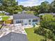 The home boasts an open yard and patio area perfect for outdoor relaxation at 4007 S Renellie Dr, Tampa, FL 33611