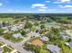 Beautiful aerial view of the homes in a neighborhood with an abundance of trees and green landscaping at 4646 Lacrosse Ct, New Port Richey, FL 34655