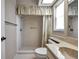 Bathroom with a combination shower-tub, skylight, and a large mirror over the sink at 4646 Lacrosse Ct, New Port Richey, FL 34655