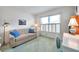 Inviting bedroom with a comfortable couch, desk and bright window at 4646 Lacrosse Ct, New Port Richey, FL 34655