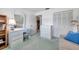 Bedroom with a desk, vanity, closet, and comfortable couch at 4646 Lacrosse Ct, New Port Richey, FL 34655