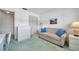 Cozy bedroom featuring a comfortable couch, closet, and desk at 4646 Lacrosse Ct, New Port Richey, FL 34655