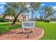 The sign for the Heritage Lake Clubhouse, landscaped with brick trim and mulch at 4646 Lacrosse Ct, New Port Richey, FL 34655