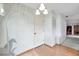 Entryway featuring a mural, closet, wood flooring, and chandelier-style lighting at 4646 Lacrosse Ct, New Port Richey, FL 34655