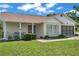 Charming single-story home featuring a screened-in garage and inviting porch, set on a well-maintained lawn at 4646 Lacrosse Ct, New Port Richey, FL 34655