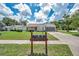 Inviting single-story home with well-kept lawn, featuring screened garage and cozy front porch at 4646 Lacrosse Ct, New Port Richey, FL 34655