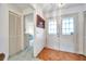 Inviting foyer with wood-look floor, closet and a view to the living area at 4646 Lacrosse Ct, New Port Richey, FL 34655