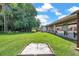 This community includes a horseshoe pit surrounded by green grass and lush landscaping at 4646 Lacrosse Ct, New Port Richey, FL 34655