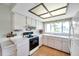 Sunlit kitchen boasting a window above sink, laminate wood floors, and white countertops at 4646 Lacrosse Ct, New Port Richey, FL 34655