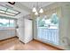 Sunlit kitchen featuring window with sheer curtains, white refrigerator, and laminate floors at 4646 Lacrosse Ct, New Port Richey, FL 34655