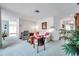 Cozy living room with carpet, comfortable seating, and natural light at 4646 Lacrosse Ct, New Port Richey, FL 34655