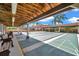 Shuffleboard courts featuring shaded seating areas and well maintained landscaping in a community setting at 4646 Lacrosse Ct, New Port Richey, FL 34655