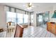 Sun room featuring tile floors, a large window with awning, and sliding doors to other rooms at 4646 Lacrosse Ct, New Port Richey, FL 34655