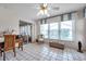 Bright sun room featuring tile floors, a large window with awning, and sliding doors at 4646 Lacrosse Ct, New Port Richey, FL 34655