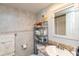 Well-lit bathroom with a granite countertop, ample storage, and tiled wall accents at 4939 Floramar Ter # 203, New Port Richey, FL 34652