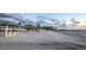 Wide sandy beach with picnic shelters and calm water in a relaxing coastal setting at 4939 Floramar Ter # 203, New Port Richey, FL 34652