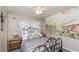 Comfortable bedroom featuring a unique bed frame, soft lighting, and serene decor at 4939 Floramar Ter # 203, New Port Richey, FL 34652