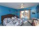 Comfortable bedroom with a calming blue color scheme and waterfront view at 4939 Floramar Ter # 203, New Port Richey, FL 34652