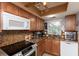 Cozy kitchen with granite countertops, modern appliances, and ample natural light for enjoyable cooking at 4939 Floramar Ter # 203, New Port Richey, FL 34652
