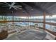 Outdoor community pavilion featuring tables and chairs, overlooking the marina and providing a scenic waterfront setting at 4939 Floramar Ter # 203, New Port Richey, FL 34652