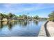 Scenic waterway view with waterfront homes and lush landscaping on a sunny day at 4939 Floramar Ter # 203, New Port Richey, FL 34652
