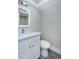 Bathroom featuring a vanity with a quartz countertop, modern fixtures, and a toilet at 4939 Floramar Ter # 812, New Port Richey, FL 34652