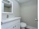 Bathroom featuring a vanity with a quartz countertop, modern fixtures, and a toilet at 4939 Floramar Ter # 812, New Port Richey, FL 34652