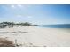 Picturesque beach with clear water and gentle waves near a home with a private pier at 4939 Floramar Ter # 812, New Port Richey, FL 34652
