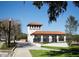 This white building in New Port Richey has a red tile roof, arched entrances and manicured landscaping at 4939 Floramar Ter # 812, New Port Richey, FL 34652