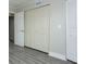 Bedroom with closet, hallway, and storage space for organized living at 4939 Floramar Ter # 812, New Port Richey, FL 34652