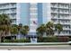 Close up of the building, sign, and the American flag at 4939 Floramar Ter # 812, New Port Richey, FL 34652
