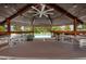 Interior of the community gazebo, with many tables and chairs for entertaining by the pool at 4939 Floramar Ter # 812, New Port Richey, FL 34652
