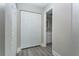 Hallway with closet space and a bathroom view, providing convenient storage and access at 4939 Floramar Ter # 812, New Port Richey, FL 34652