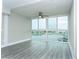 Sunlit living room with water views, enhanced by a modern ceiling fan for comfortable living at 4939 Floramar Ter # 812, New Port Richey, FL 34652
