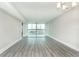 Expansive living area with large windows offering natural light and seamless design at 4939 Floramar Ter # 812, New Port Richey, FL 34652