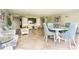 Building lobby with comfortable seating, tables and a television at 4939 Floramar Ter # 812, New Port Richey, FL 34652