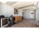 This covered patio features tile flooring, textured walls, cooking area, and access to the house at 4939 Floramar Ter # 812, New Port Richey, FL 34652