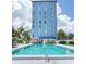 Community swimming pool area at the base of the high rise condo building at 4939 Floramar Ter # 812, New Port Richey, FL 34652