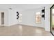 Bright, minimalist bedroom with laminate flooring, natural light, and contemporary shelving at 5021 Bridgeport Dr, Safety Harbor, FL 34695