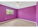 Bedroom featuring hardwood floors, closet, and a window at 5021 Bridgeport Dr, Safety Harbor, FL 34695