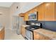 Well-equipped kitchen with stainless steel appliances and ample cabinet space at 5021 Bridgeport Dr, Safety Harbor, FL 34695
