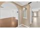 Bright living room featuring sleek wood flooring, arched doorways and neutral paint at 5021 Bridgeport Dr, Safety Harbor, FL 34695