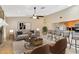 Bright living room with stone fireplace, modern furnishings, and an open floor plan at 5021 Bridgeport Dr, Safety Harbor, FL 34695