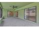 Large outdoor patio with sliding glass doors, perfect for entertaining at 5021 Bridgeport Dr, Safety Harbor, FL 34695