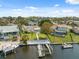 Aerial view of waterfront home with a private dock and boat lift for easy canal access at 5348 Lawrence Ln, New Port Richey, FL 34652