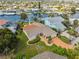 Waterfront house aerial view features backyard and canal access for boating at 5348 Lawrence Ln, New Port Richey, FL 34652
