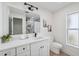 Well-lit bathroom showcasing a vanity with modern fixtures, marble tiled shower and a sleek design at 5348 Lawrence Ln, New Port Richey, FL 34652