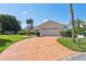 Charming single-story home with a well-maintained lawn and a stamped concrete driveway at 5348 Lawrence Ln, New Port Richey, FL 34652