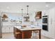 Bright kitchen featuring custom cabinets, a center island, and modern stainless steel appliances at 5348 Lawrence Ln, New Port Richey, FL 34652